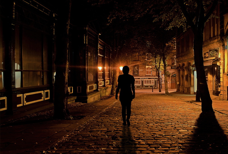 footpath, illuminated, paving stone, dark, walking, lighting, real people, empty, 4K, full length, besides, building exterior, fear, uncertainty, woman go