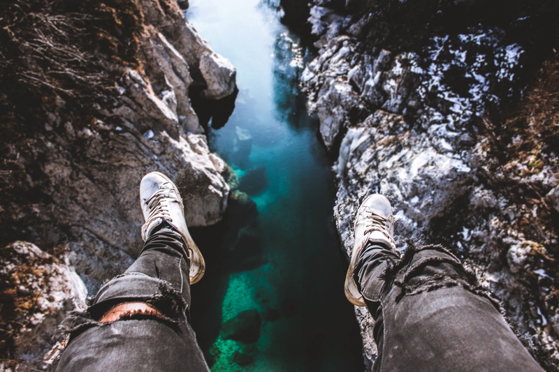 adults only, jeans, tree, shoe, valley, water, personal perspective, nature, real people, man, human body part, body part, edge, people, outdoors, view