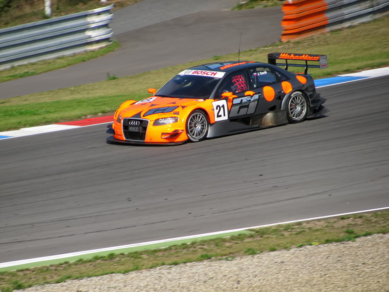 automobiles, toy, fast, motor racing track, motors, high angle view, vehicles, sunlight, racecar, outdoors, motor, sports, wheel, speed, land vehicle, day