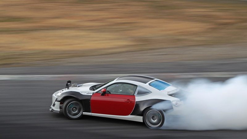 excitement, land vehicle, red, blurred motion, on the move, people, road, car, motion, side view, wealth, sports race, motor vehicle, toyota rs r, mode of transportation