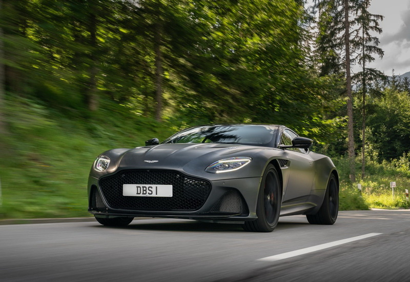 mode of transportation, motion, road trip, dbs, tree, day, plant, road, travel, aston, car, transportation, grey, silver colored, wheel, outdoors, blurred motion