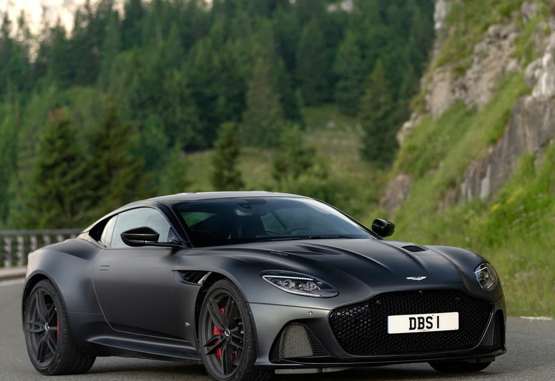 motion, transportation, focus on foreground, 720P, xenon, mode of transportation, dbs, sports car, mountain, wealth, grey, plant, silver colored, luxury
