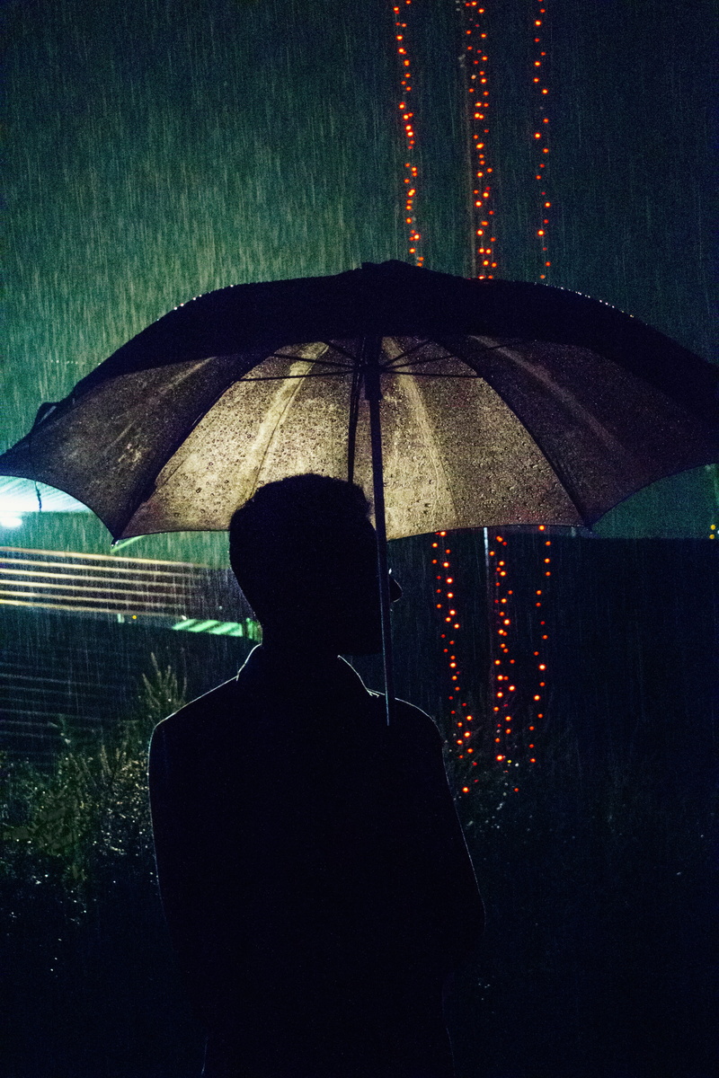 one person, night, water, protection, sri lanka, real people, adult, rear view, leisure activity, 5K, illuminated, security, wet, lifestyles, rain, men