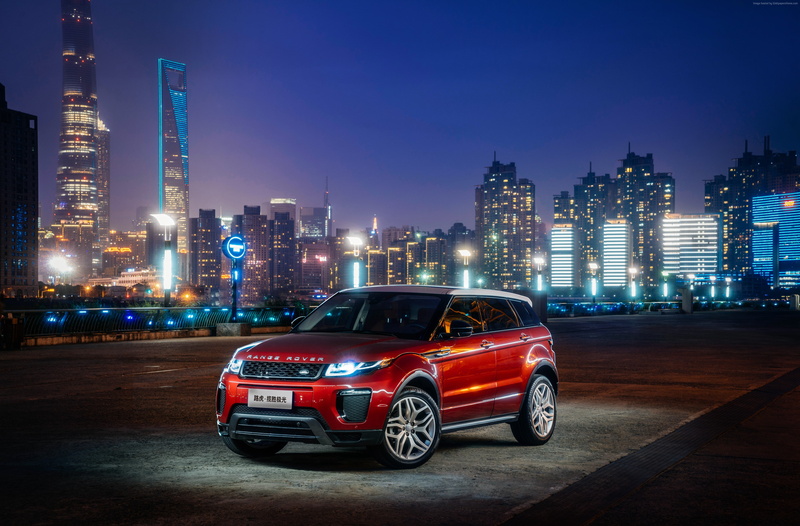 urban skyline, city life, red, office building exterior, luxury, Range Rover Evoque, building exterior, sky, modern, car, mode of transportation, outdoors