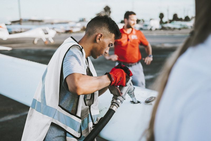 person, pembroke pines, north perry airport, standing, clothing, jet fuel, young adult, waist up, human, people, transportation, airfield, side view, aircraft