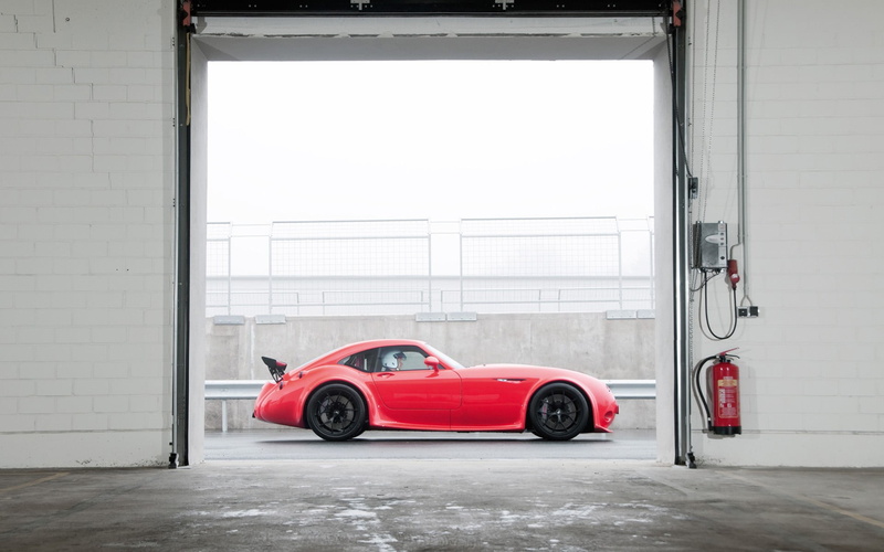 copy space, day, Wiesmann GT MF4-CS, land vehicle, outdoors, entrance, built structure, no people, safety, travel, window, mode of transportation, red cars