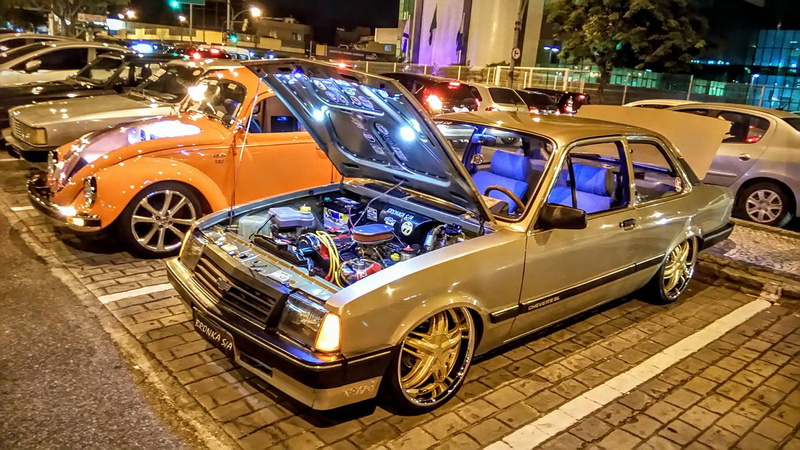 street, car, parking, mode of transportation, city street, road, no people, illuminated, stationary, retro styled, vintage car, city, land vehicle, Chevette