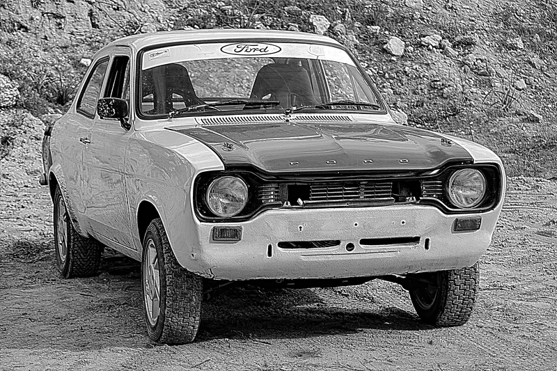 outdoors, day, retro styled, mode of transportation, road, city, black and white, transportation, car, old, stationary, ford escort mk1, rally, no people
