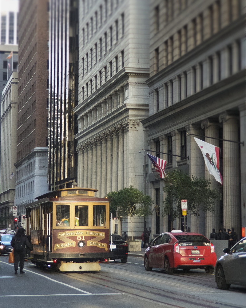 built structure, human, tram, skyscraper, city life, person, motion, double-decker bus, mode of transportation, public transportation, city street, building exterior