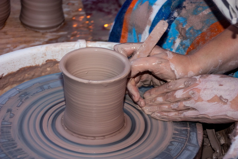 making, one person, human body part, mud, dirt, handicraft, work, pottery, molding a shape, wheel, person, human hand, touching, creation, body part, turn