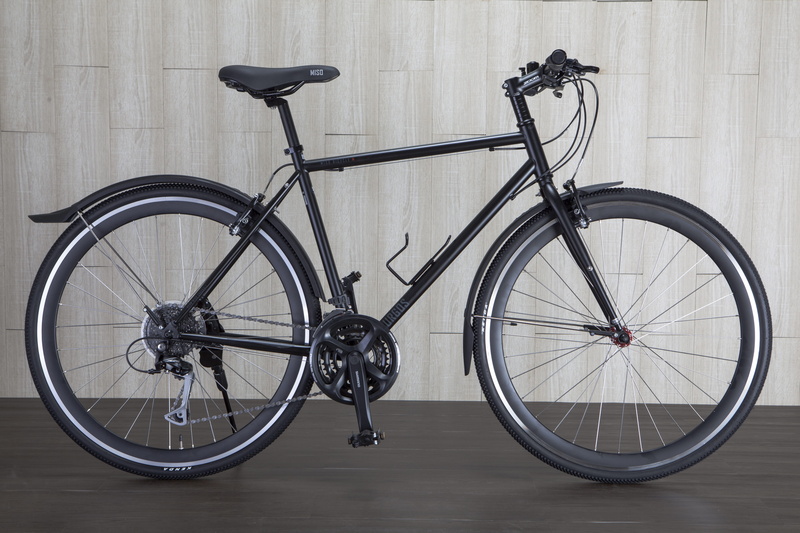 transportation system, recreation, bicycle, architecture, brake, 5K, tire, black, parking, city, wall, stationary, no people, handlebar, spoke, vehicle