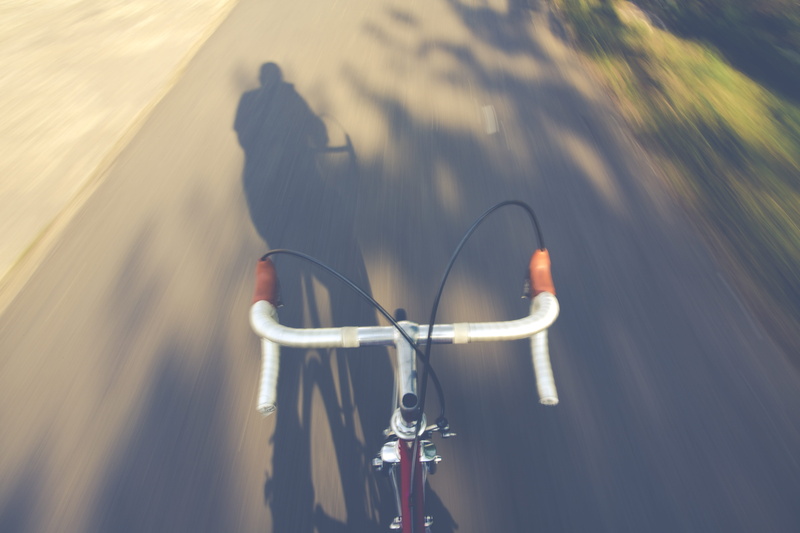 5K, transportation system, mode of transportation, ride, focus on shadow, urban, cables, steel, person, shadow, sunlight, riding, brakes, leisure activity