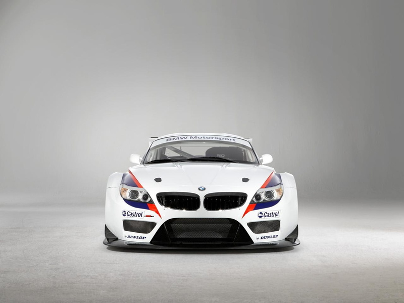 sports car, z, 720P, copy space, people, mode of transportation, sports helmet, success, indoors, racecar, transportation, car, gray, gt, front view, gray background