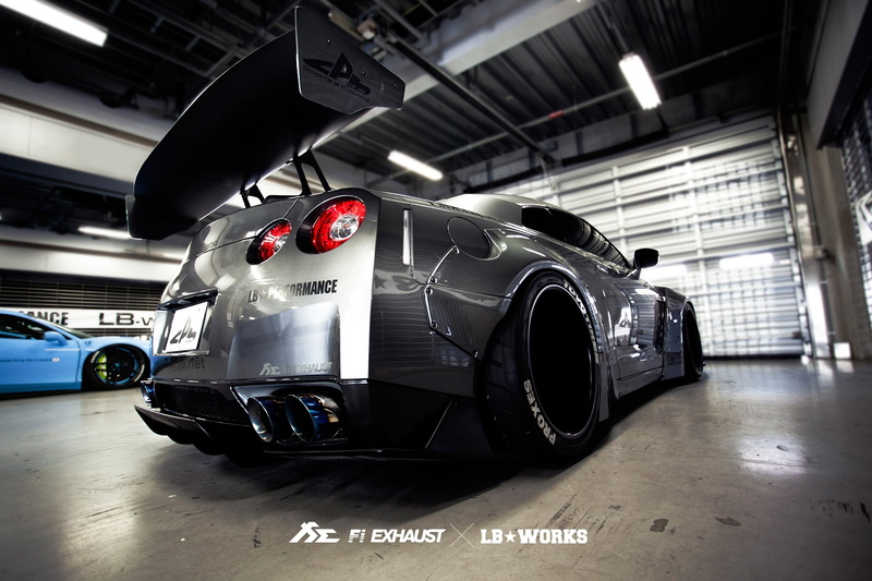 tuning, showroom, sign, GTR, tire, parking lot, text, indoors, mode of transportation, 1080P, luxury, architecture, lighting equipment, land vehicle, parking garage