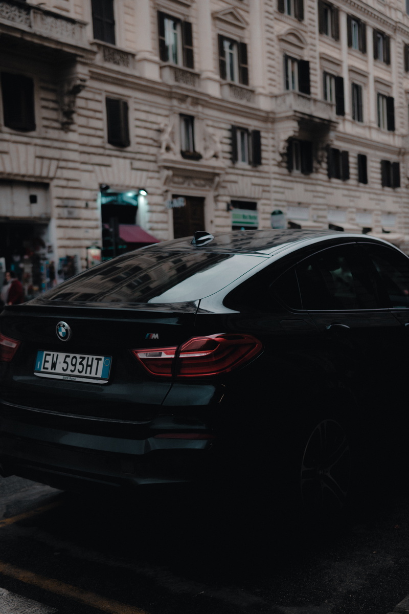 building exterior, motion, mode of transportation, black, speed, mode of Transport, travel, motor vehicle, luxury, rear view, sports Car, land Vehicle