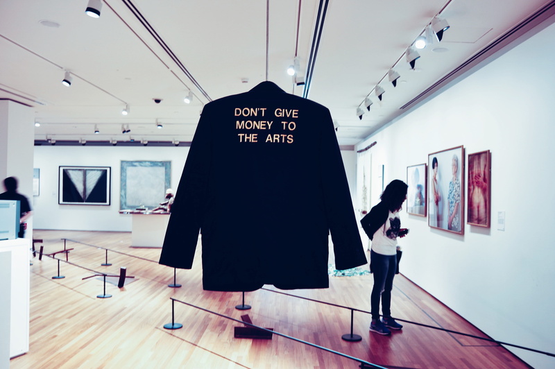 gallery, casual clothing, people, blazer, men, adult, rear view, jacket, hanging, black coat, ceiling, one person, modern, western script, 5K, communication