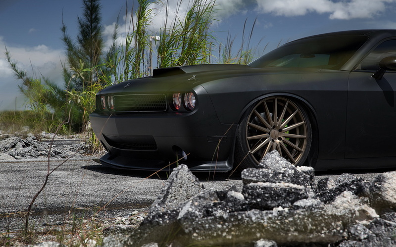 no people, car, wheel, sky, tuning, outdoors, plant, cloud - sky, black, transportation, mode of transportation, nature, tire, field, motor vehicle, stationary
