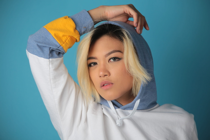woman, eyes, hairstyle, arms raised, hair, teal, front view, pretty, girl, blue, young adult, person, close-up, blonde, studio shot, beautiful woman, adult