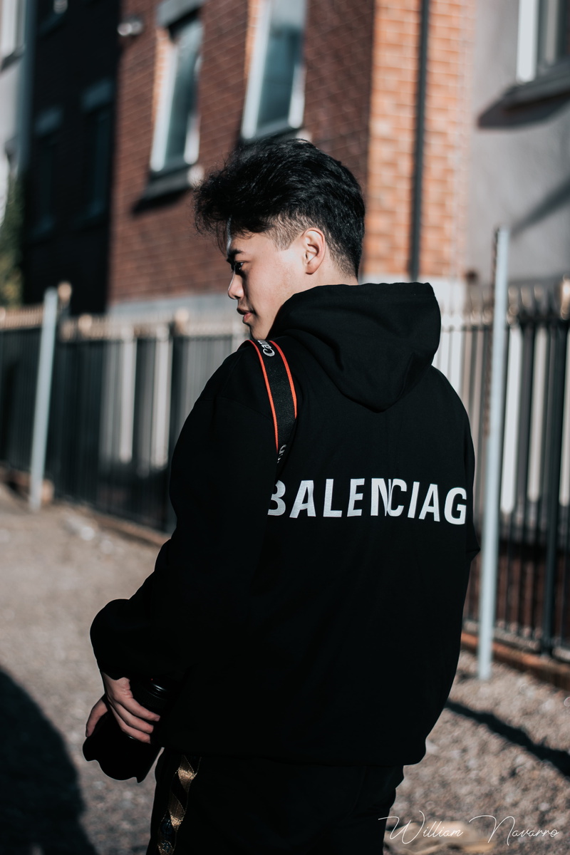 balenciaga, city, hair, 5K, leisure activity, banister, clothing, warm clothing, lifestyles, building exterior, railing, outdoors, canon, standing, communication