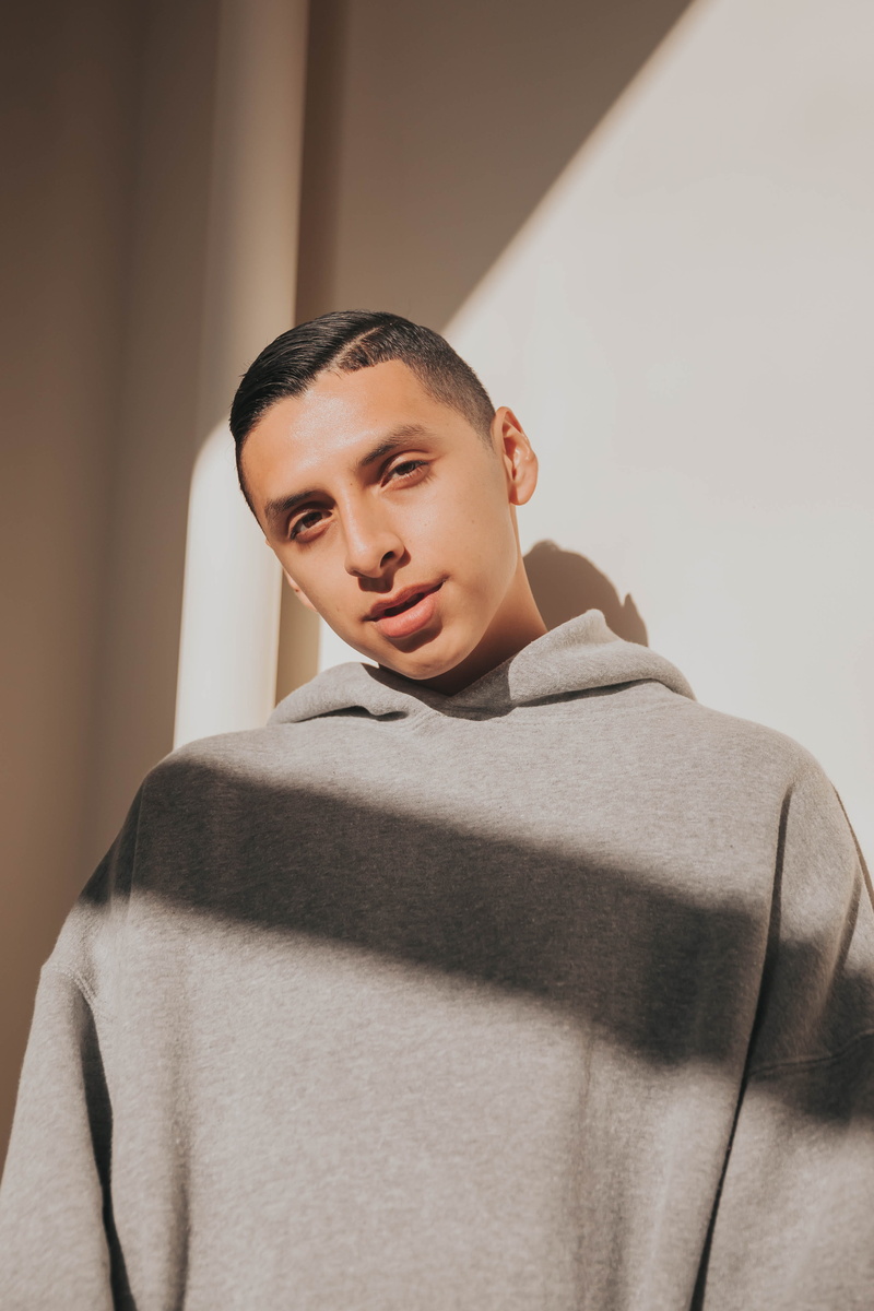 coat, dazed, man, human, long sleeve, hood, contemplation, young adult, day, front view, fashion, urban, relaxation, shadows, hoodie, lifestyles, sweater