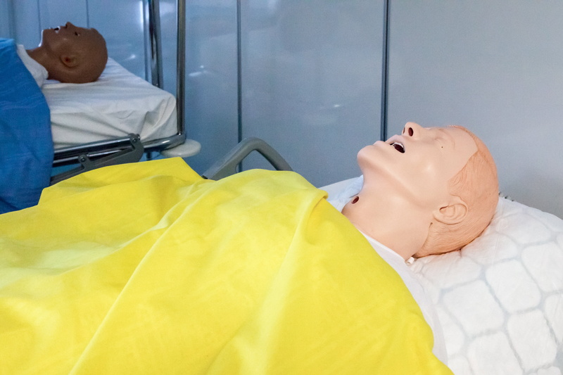 education, health, paramedic, child, 4K, patient, care, medical, medicine, occupation, furniture, classroom, people, bed, clothing, lying on back, dummy