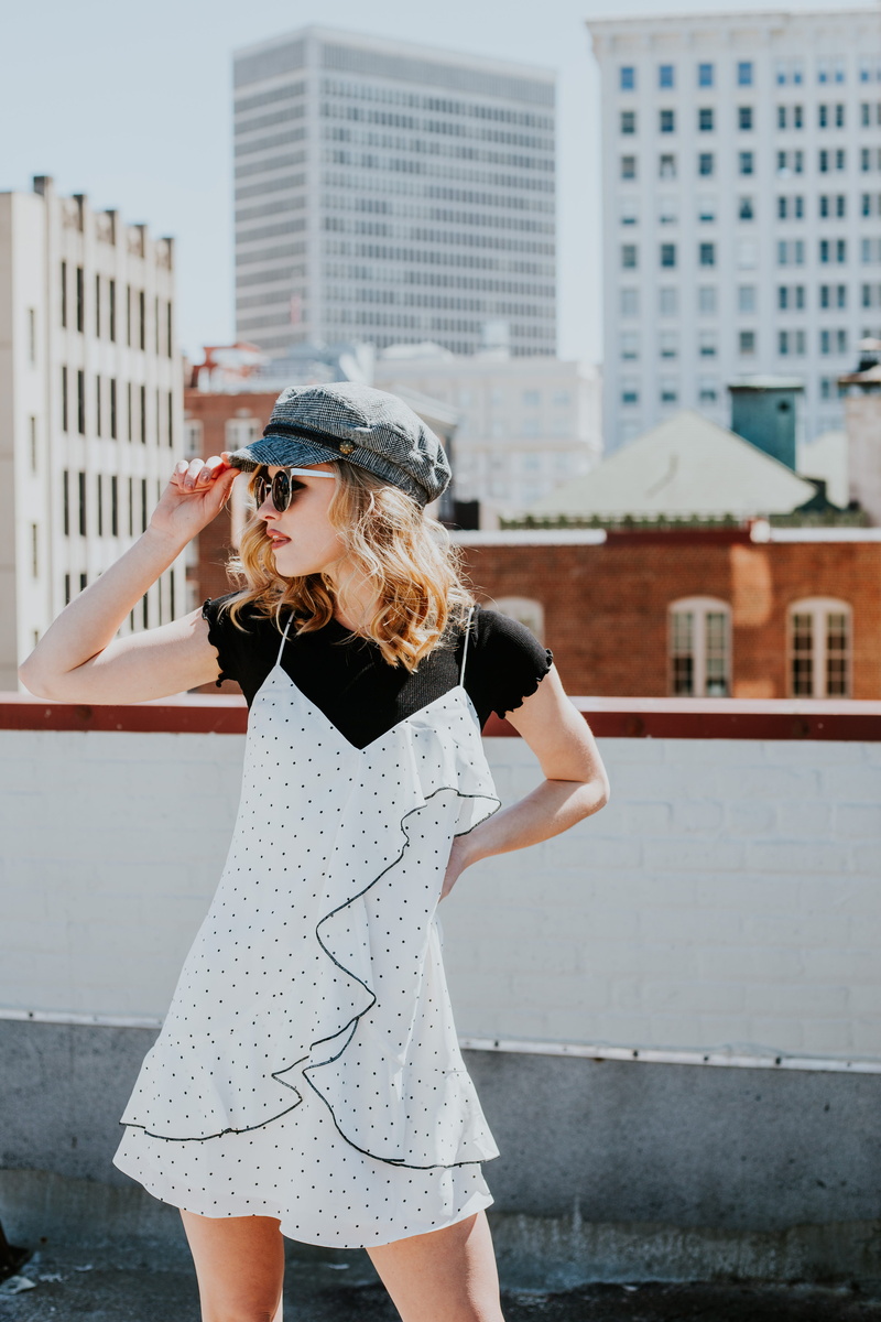 hat, holding, girl, women, black, real people, skyline, hairstyle, daytime, three quarter length, sunglasses, white, day, model, style, young women, architecture