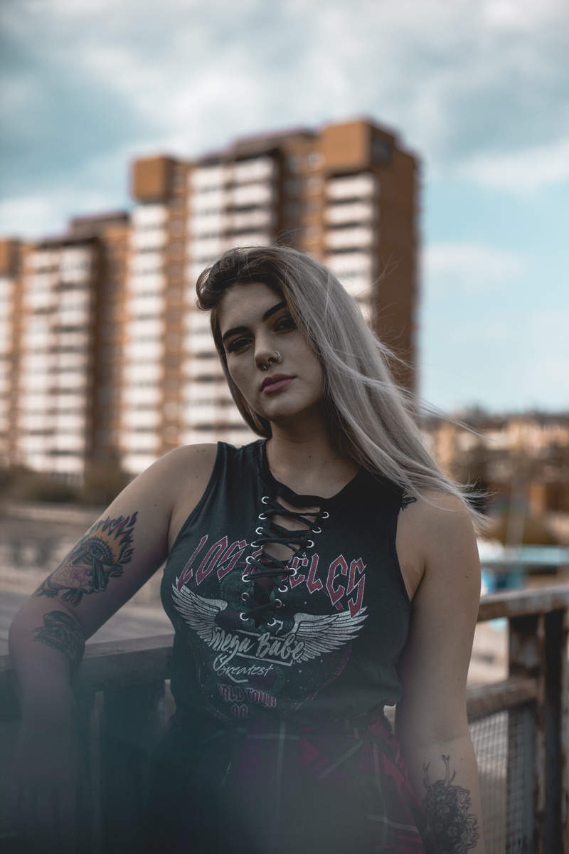 pose, tattoo, standing, urban, cage, architecture, leisure activity, modern, front view, pretty, beautiful, dyed hair, real people, portrait, tattoos, waist up