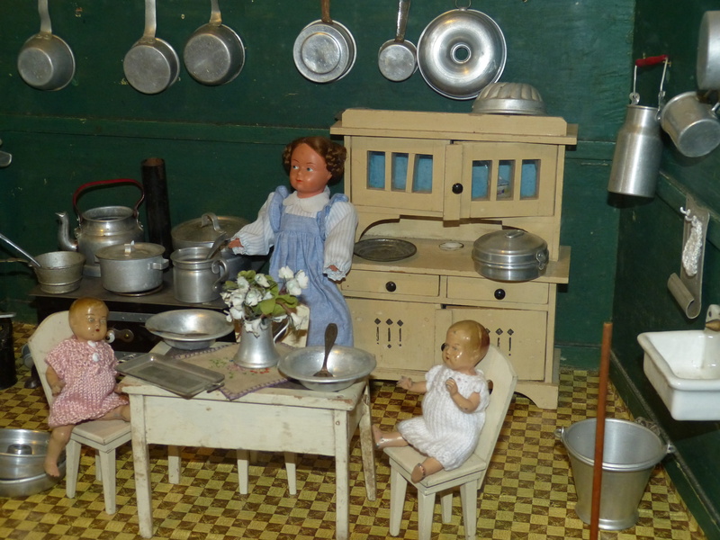 indoors, lifestyles, food and drink, women, nostalgic, domestic room, domestic kitchen, front view, historically, males, Play, cabinet, doll, real people