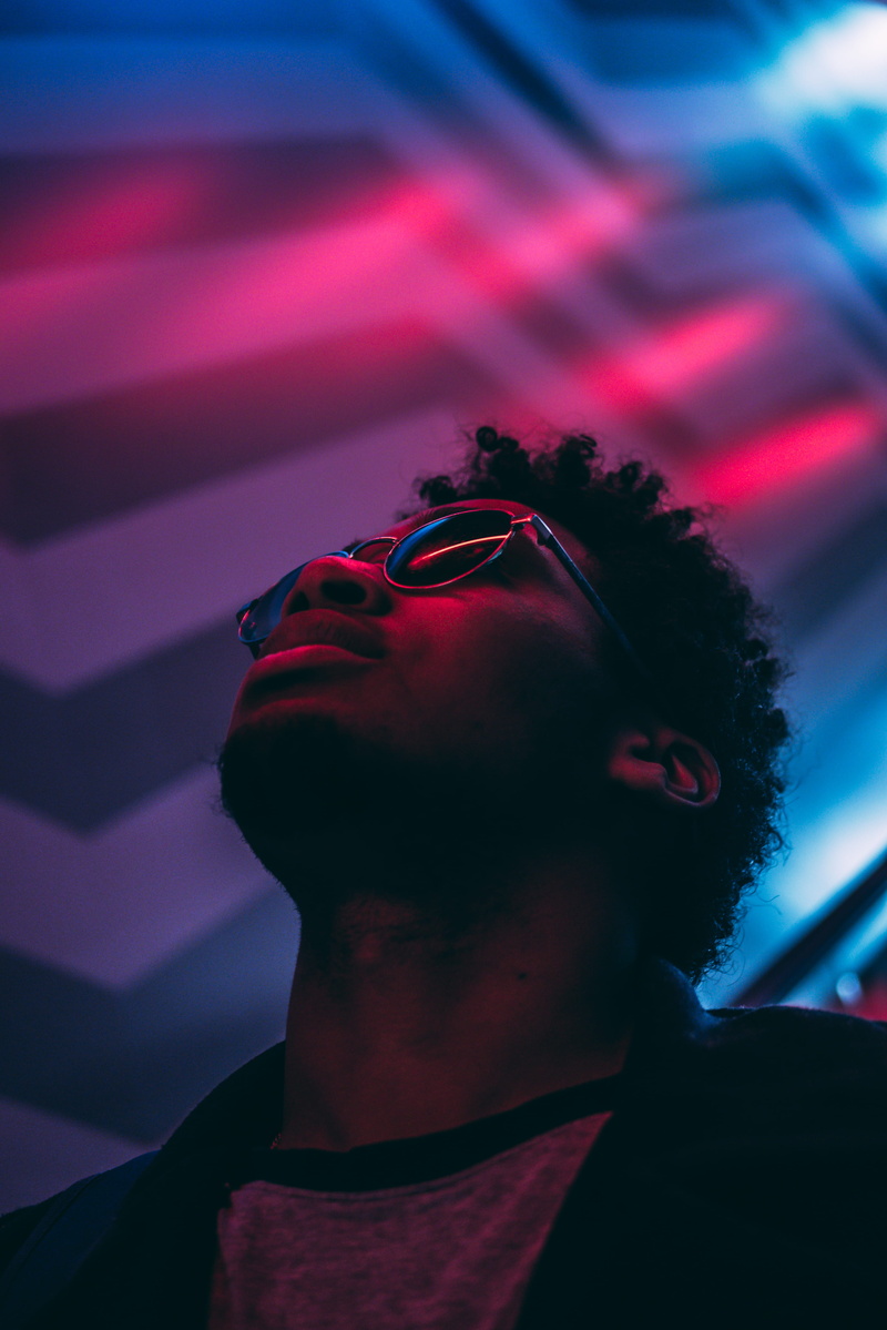 young adult, man, panasonic, men, real people, contemplation, 4K, purple, front view, black hair, looking, blue, headshot, lifestyles, glasses, hairstyle