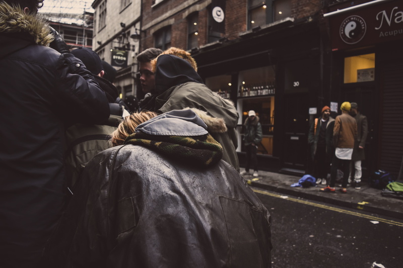 day, real people, social issues, city life, fashion, group of people, rear view, speculators, men, building, building exterior, adult, fall, autumn, alley