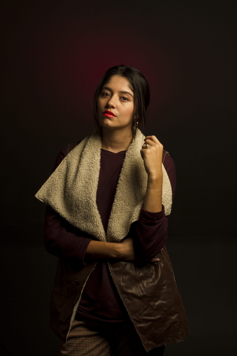 leather, adult, brown, medellin, contemplation, indoors, standing, long sleeve, beauty, wearing, black background, warm clothing, fashion, three quarter length