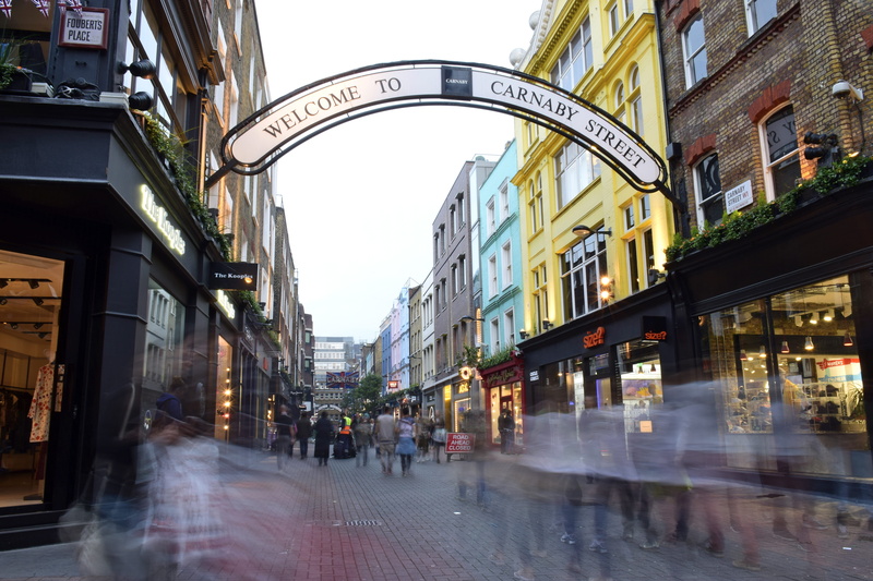 movement, walking, london, large group of people, street, united kingdom, building exterior, sign, architecture, blurred motion, day, crowd, shops, city life