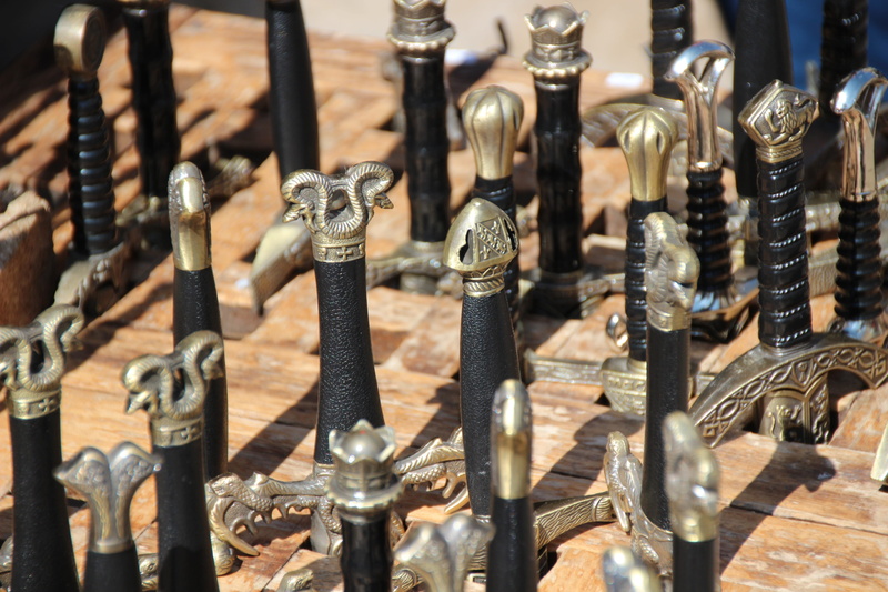 Weapons, focus on foreground, abundance, selective focus, antique, indoors, metal, middle ages, large group of objects, 5K, musical instrument, armor
