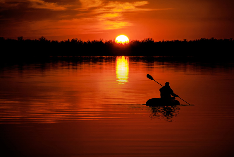 back, mode of transportation, river, 5K, waterfront, tranquil scene, reflection, lake, lifestyles, goal, person, beauty in nature, zodiac