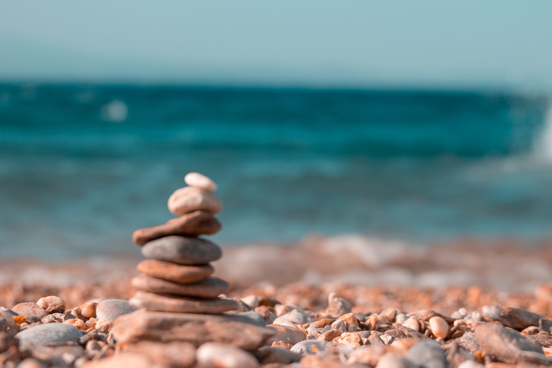 beauty in nature, sky, tranquility, day, archaeology, selective focus, greece, water, scenics - nature, pebble, stone tower, horizon, rust, stone - object