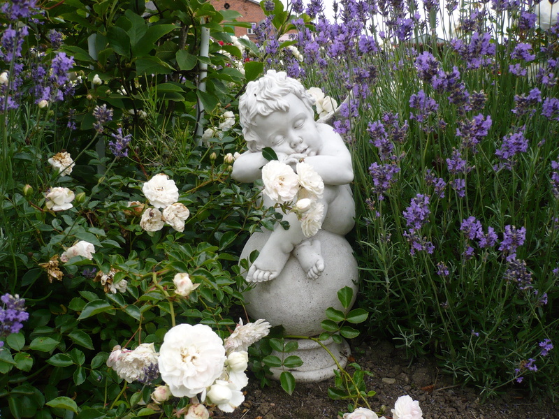 vulnerability, cherub, purple, plant, fragility, 2K, flowerbed, high angle view, sculpture, growth, human representation, no people, representation, day