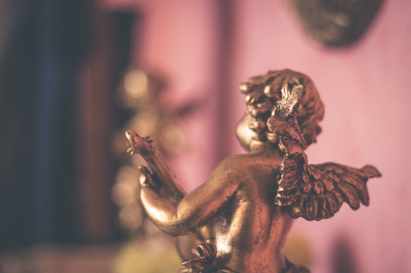 no People, wings, close-up, figurine, craft, art and craft, indoors, statue, old, cherub, spirituality, decoration, focus on foreground, antique, selective focus