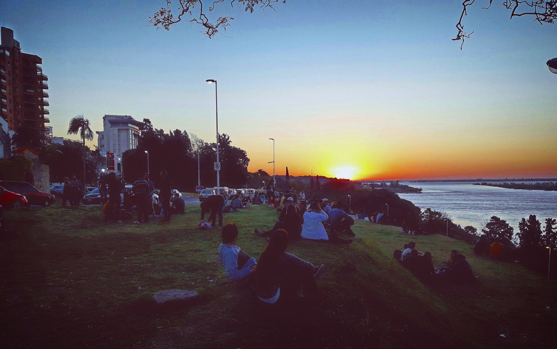 beach, parana, argentina, group of people, sitting, plant, women, men, outdoors, nature, water, land, people, sky, real people, sunset, crowd, leisure activity