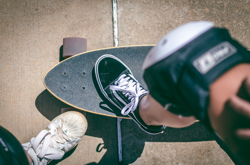 day, close-up, helmet, clothing, vans, focus, standing, lifestyles, people, sports equipment, wear, boys, person, headwear, skate, real people, men, knee pad