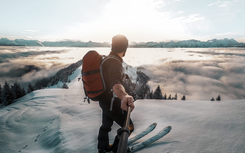 nature, cloud - sky, sun, holding, covered, hill, snow, man, daytime, beauty in nature, selfie, riding, aerial, front, standing, sport, people, stick, outdoors