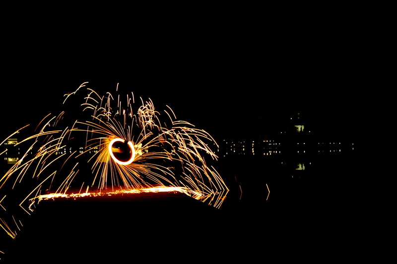 wire wool, sparks, sparkles, light painting, outdoors, motion, spin, city, one person, dark, building exterior, bridge, night, spinning, steel, illuminated