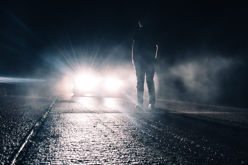 one person, body part, illuminated, headlight, asphalt, standing, arms raised, transportation, person, 5K, weather, night time, car, limb, back lit, city
