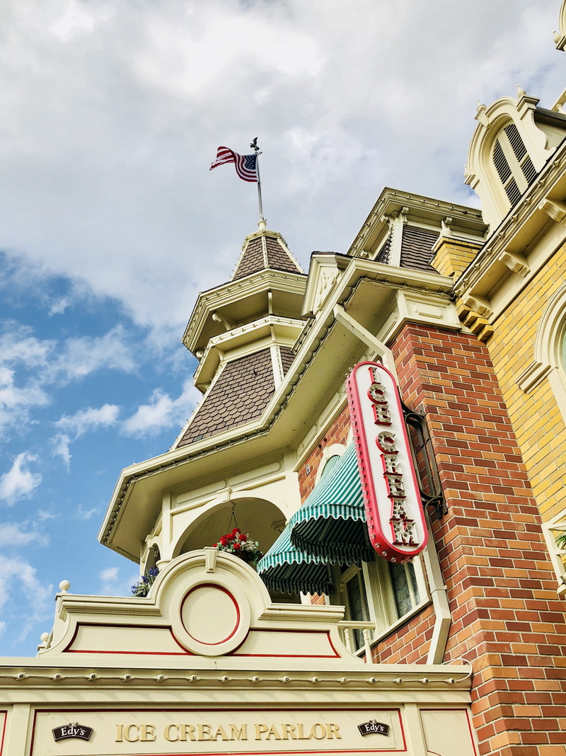 main street usa, spire, no people, day, nature, built structure, patriotism, ice cream shopfront, low angle view, architecture, sky, cloud - sky, communication