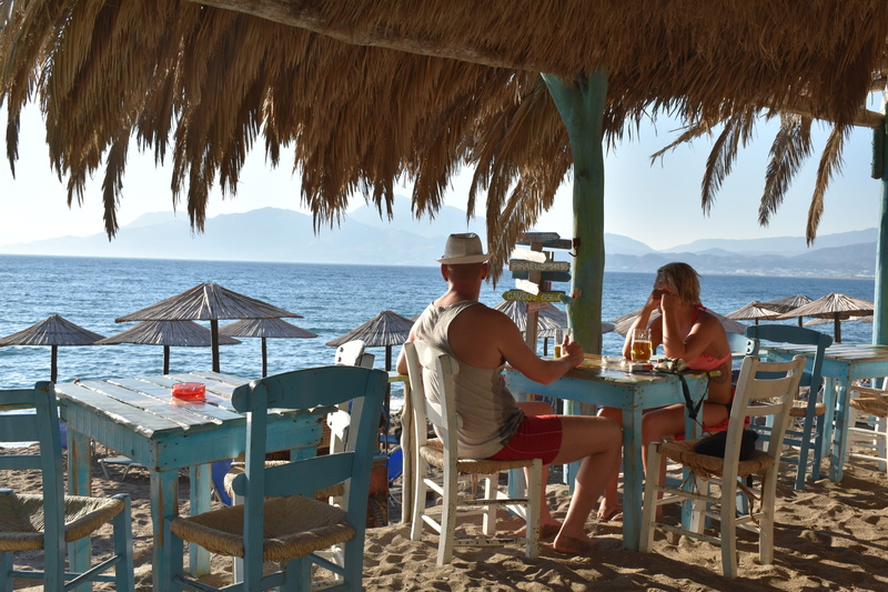 greece, greek, women, water, vacations, real people, couple - relationship, nature, seat, relaxation, holiday, sitting, horizon over water, sky, beach bar