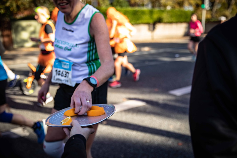 5K, city, people, citrus fruit, plate, three quarter length, adult, incidental people, focus on foreground, sliced, street, group of people, picks, men