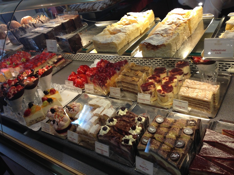 cake, no people, high angle view, indoors, dessert, temptation, retail, cakes, for sale, still life, sweet food, ready-to-eat, freshness, display cabinet