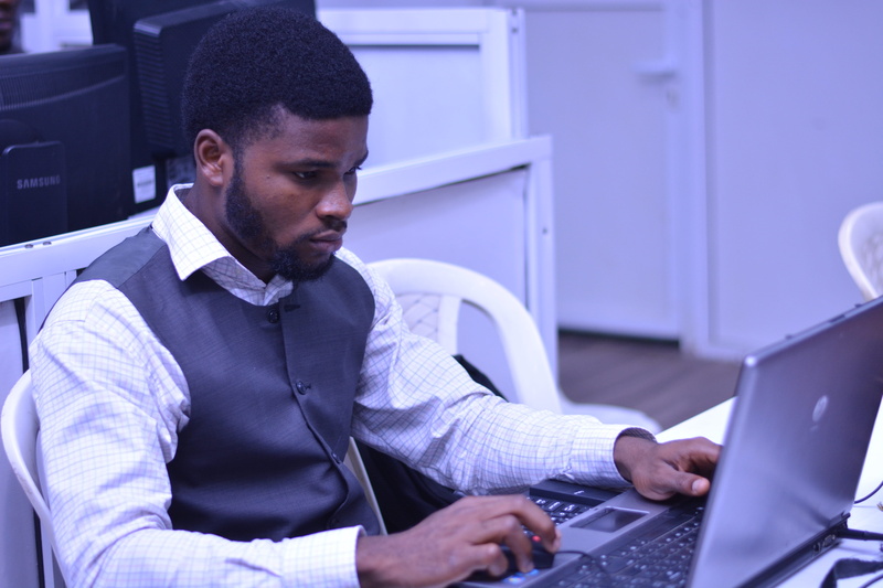 using laptop, sitting, businessman, looking, men, connection, close-up, room, technology, computer, young adult, office, laptop, facial expression, chair