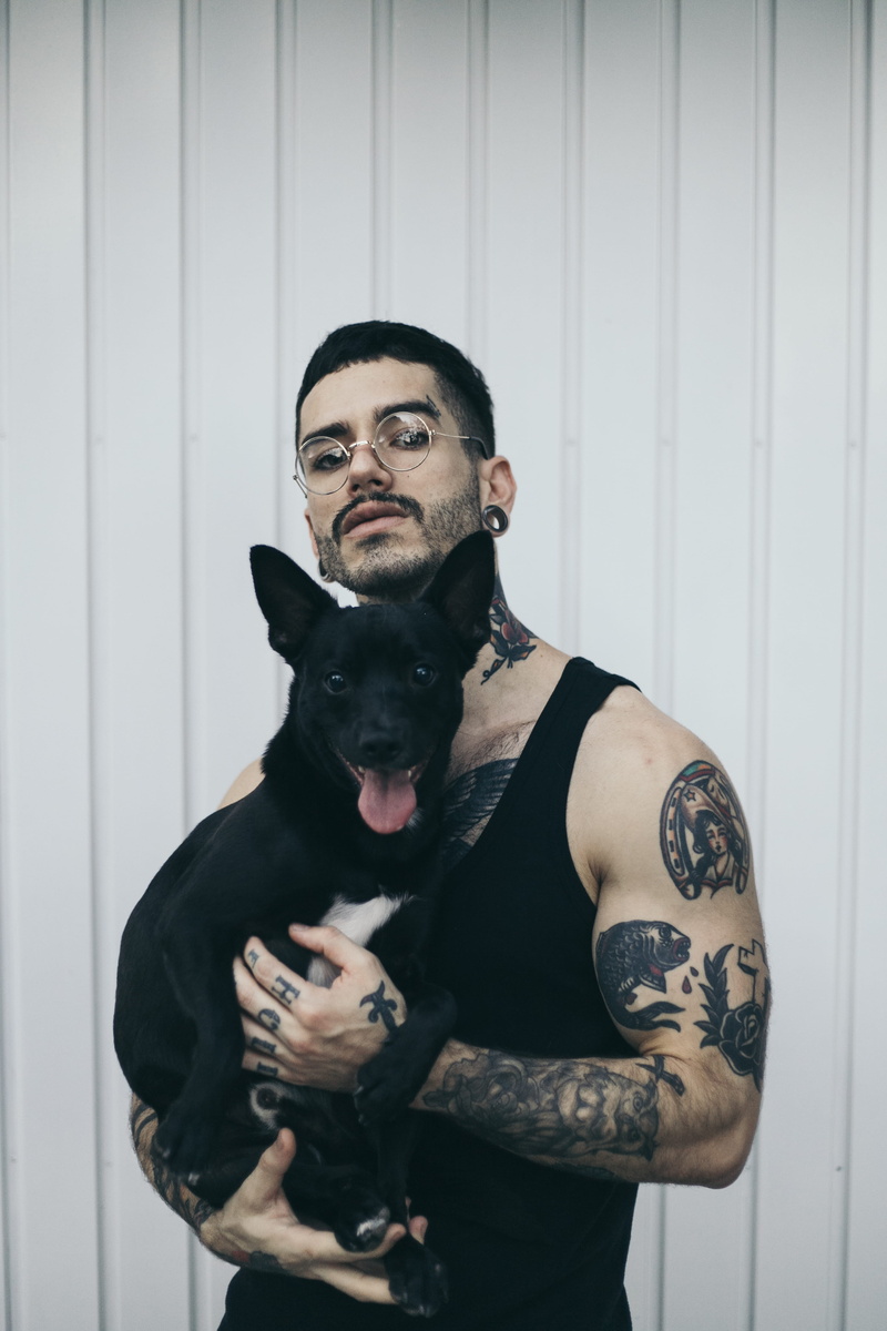 black, recreation, front view, breed, portrait, short, outfit, handsome, facial hair, pose, cute, dog, tattoo, man, facial expression, carrying, adorable