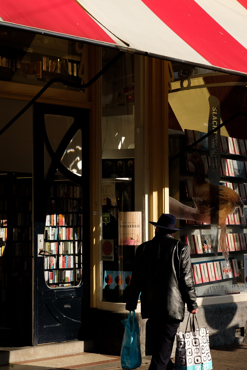 human, adult, real people, bookcase, bag, shopping, newsstand, lifestyles, couch, person, library, walking, book, men, man, bookstore, leisure activity