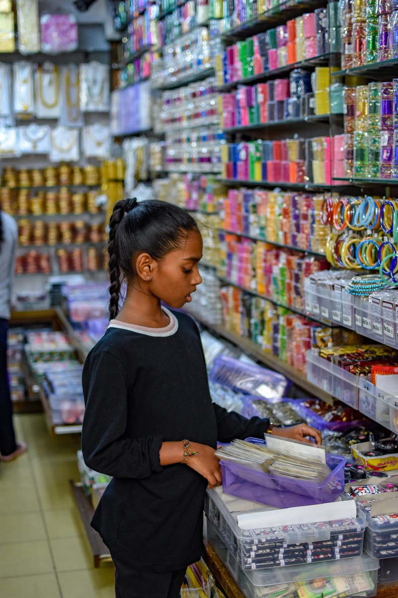 black, long, newsstand, shirt, child, people, females, supermarket, human, standing, book, store, consumerism, crew, bench, real people, groceries, display